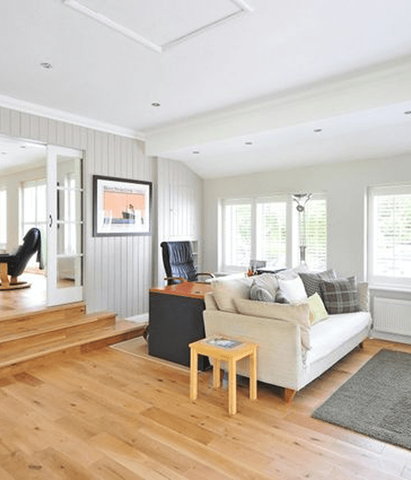 Modern living room with wooden flooring.