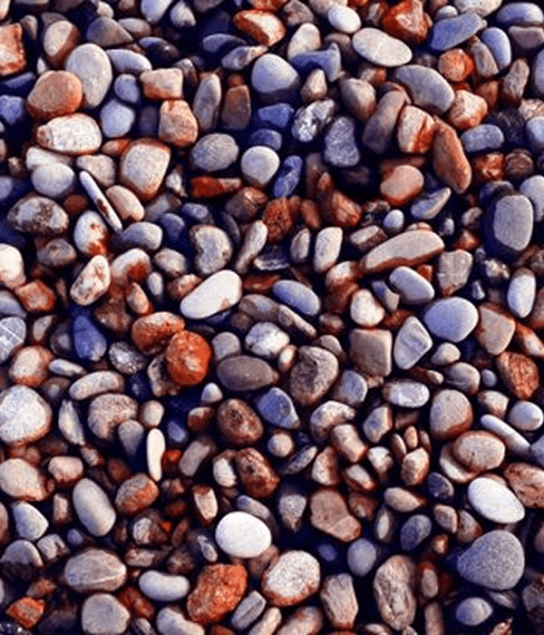 Multicolored pebbles scattered on the ground.