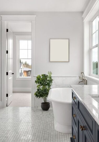 Modern bathroom with tub and glass shower.